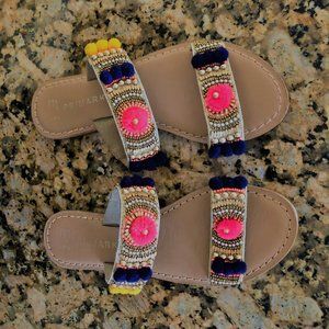 Leather beaded slippers with pom-poms